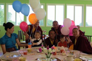 Minling Dungse Rinpoche celebrates his 1st birthday along with his elder sister, Jetsün Rinpoche, Ven. Acarya Namdrol Gyatso la, Ven. Thrinley Gyaltsen al, Anila Choenyid Choedron, Anila Thaye Choedron and Yeshe Choedron.