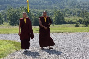Ven. Acarya Namdrol Gyatso and Ven. Thrinley Gyaltsen arrive at the shrine room for the first day of teachings.