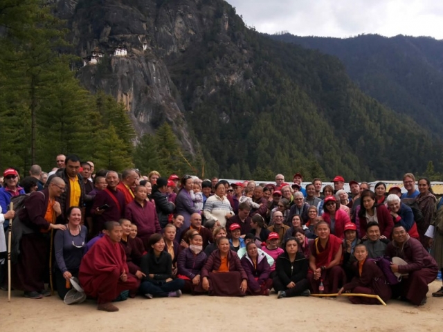 The Mindrolling family, the monks and nuns of Mindrolling along with sangha members pose at the foot of Taktsang after their descent from the sacred site. Bhutan, April 2016.