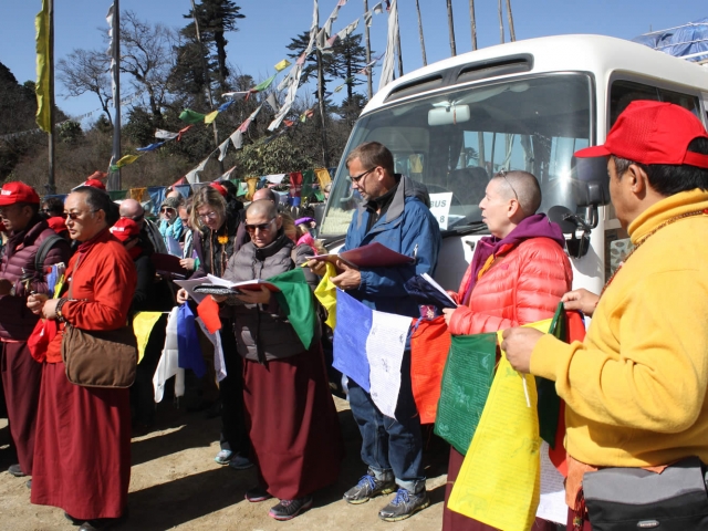 Preparing to hang prayer flags at Pelela Pass. Bhutan, March 2016
