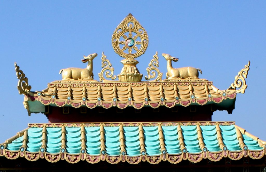 The Mindrol Gatsal ornament of the dharmachakra, deer and parasol will be similar to that on the main gate to Mindrolling Monastery.