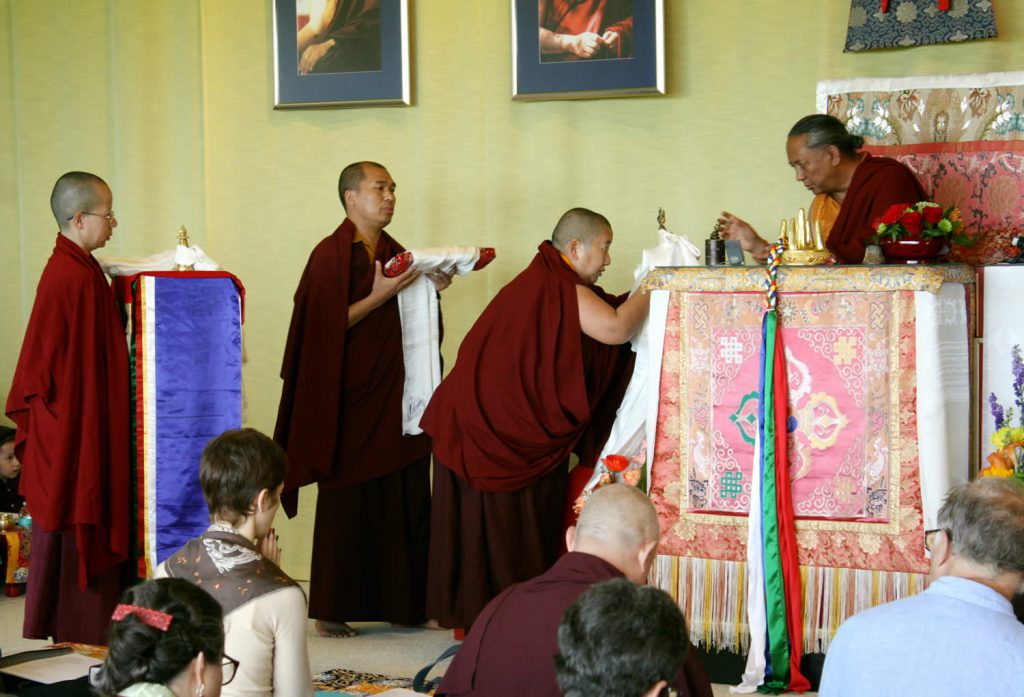 H.E. Jetsün Khandro Rinpoche makes the Body, Speech and Mind Offerings to H.E. Dzigar Kongtrul Rinpoche