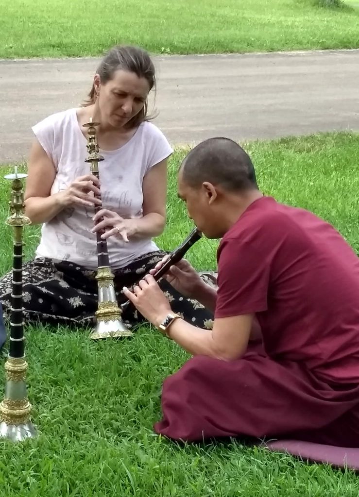 Ven. Lama Thrinley Gyaltsen and student practicing <em>kangling</em>