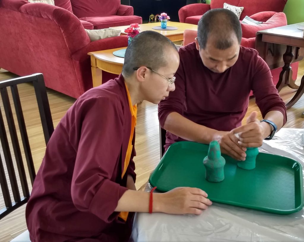 Ven. Lama Thrinley Gyaltsen la and student during torma class