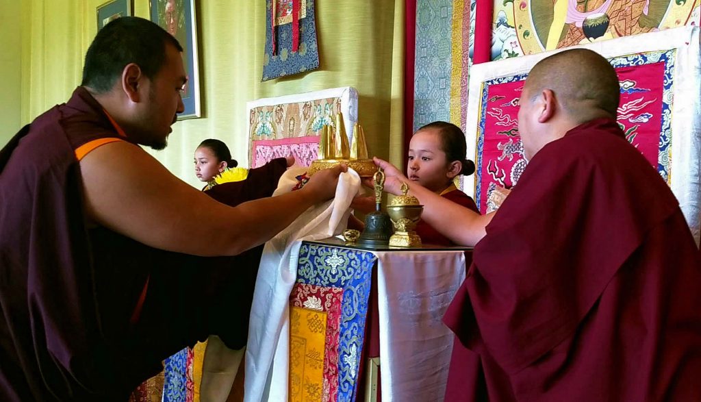 Ven. Choktrul Ngawang Jigdral Rinpoche offers the mandala to Minling Dungse Rinpoche